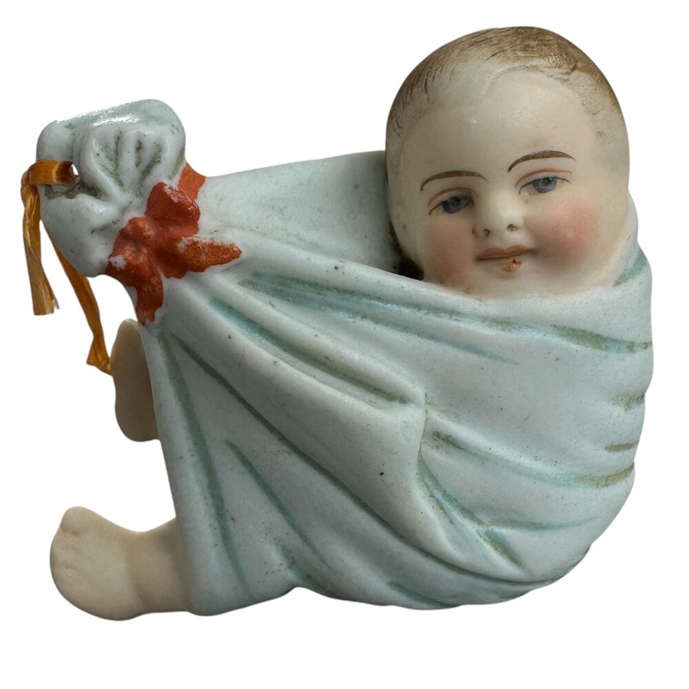 German Porcelain Bisque Oil Lamp Swing Baby Cradled In Delivery Blanket Ornament